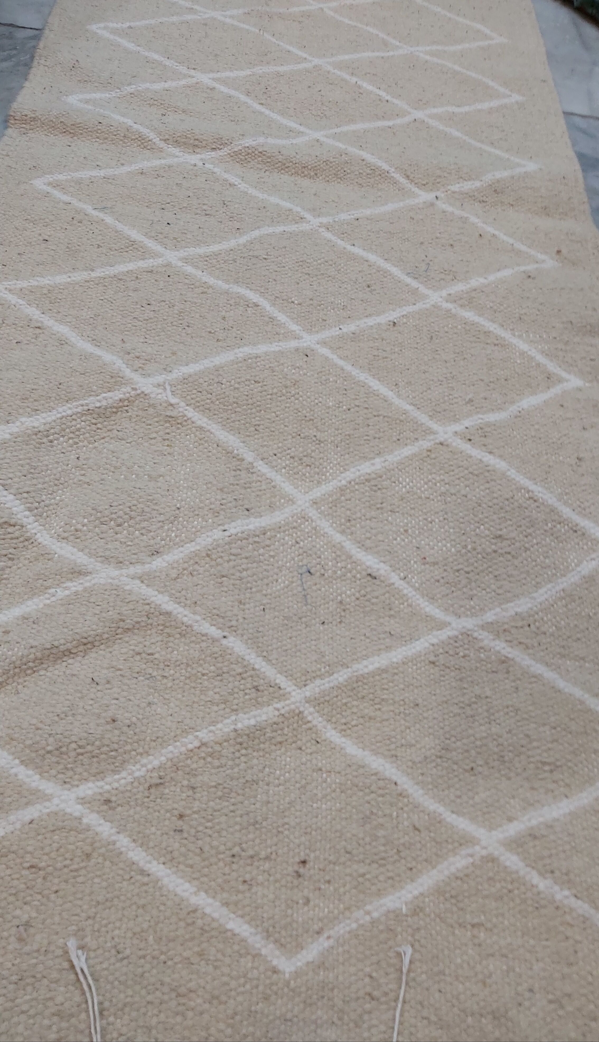 Hand-made beige and white wool rug 65x144cm