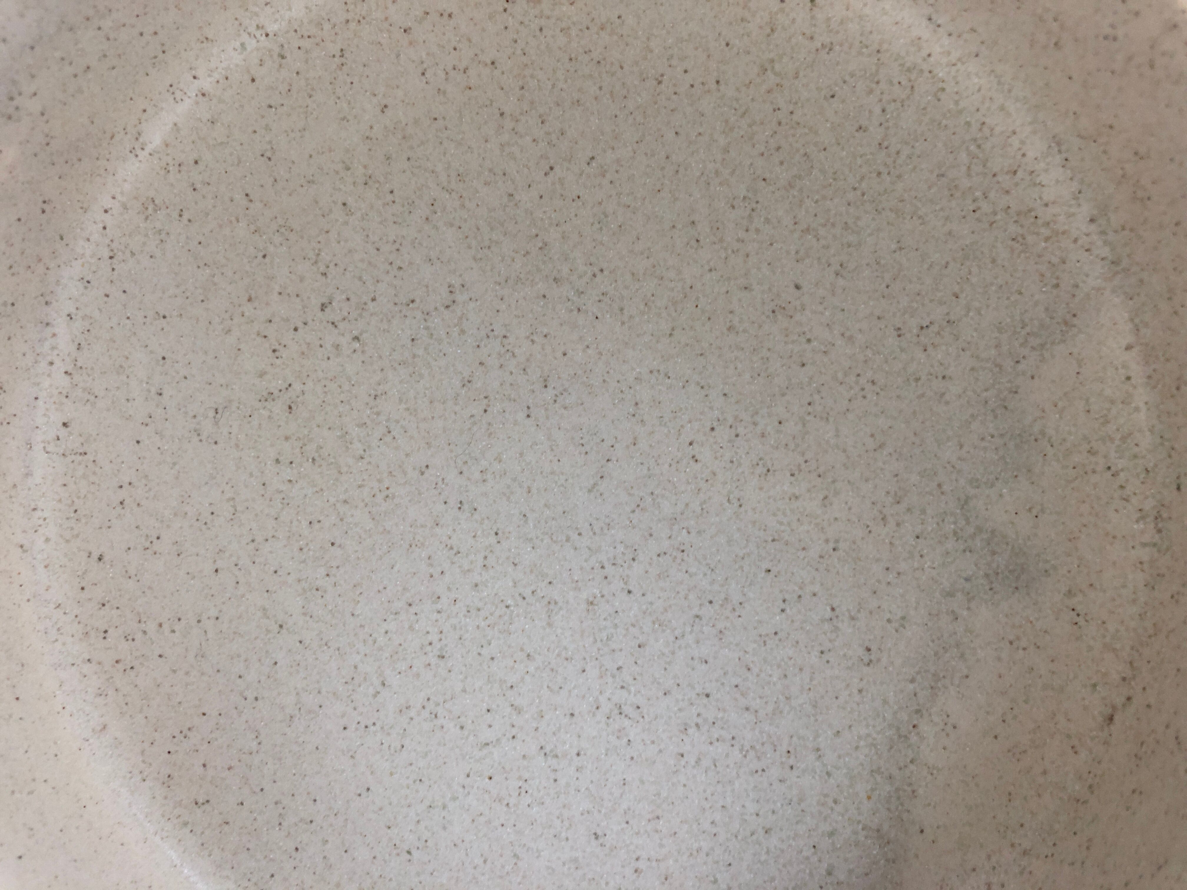Dish with Bell in speckled sandstone