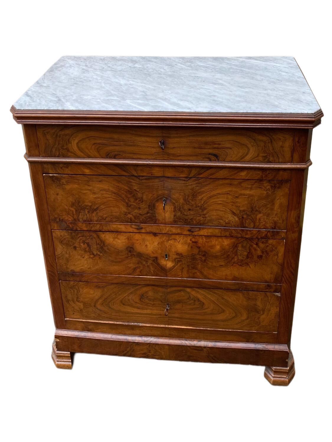 Antique Louis Philippe style chest of drawers with a white marble top.