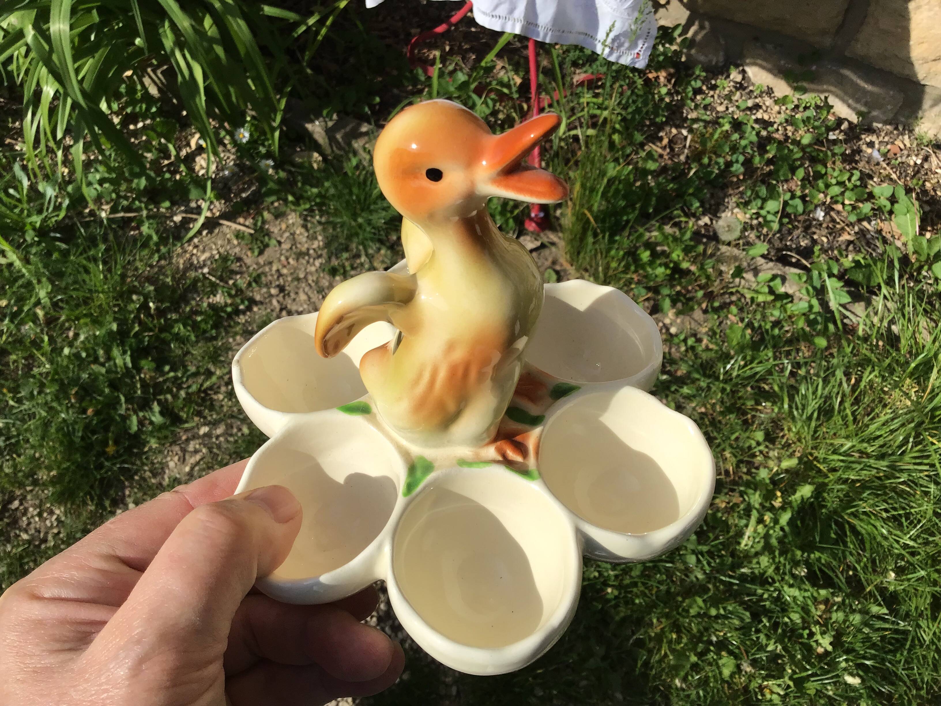Egg cup with central chick decoration