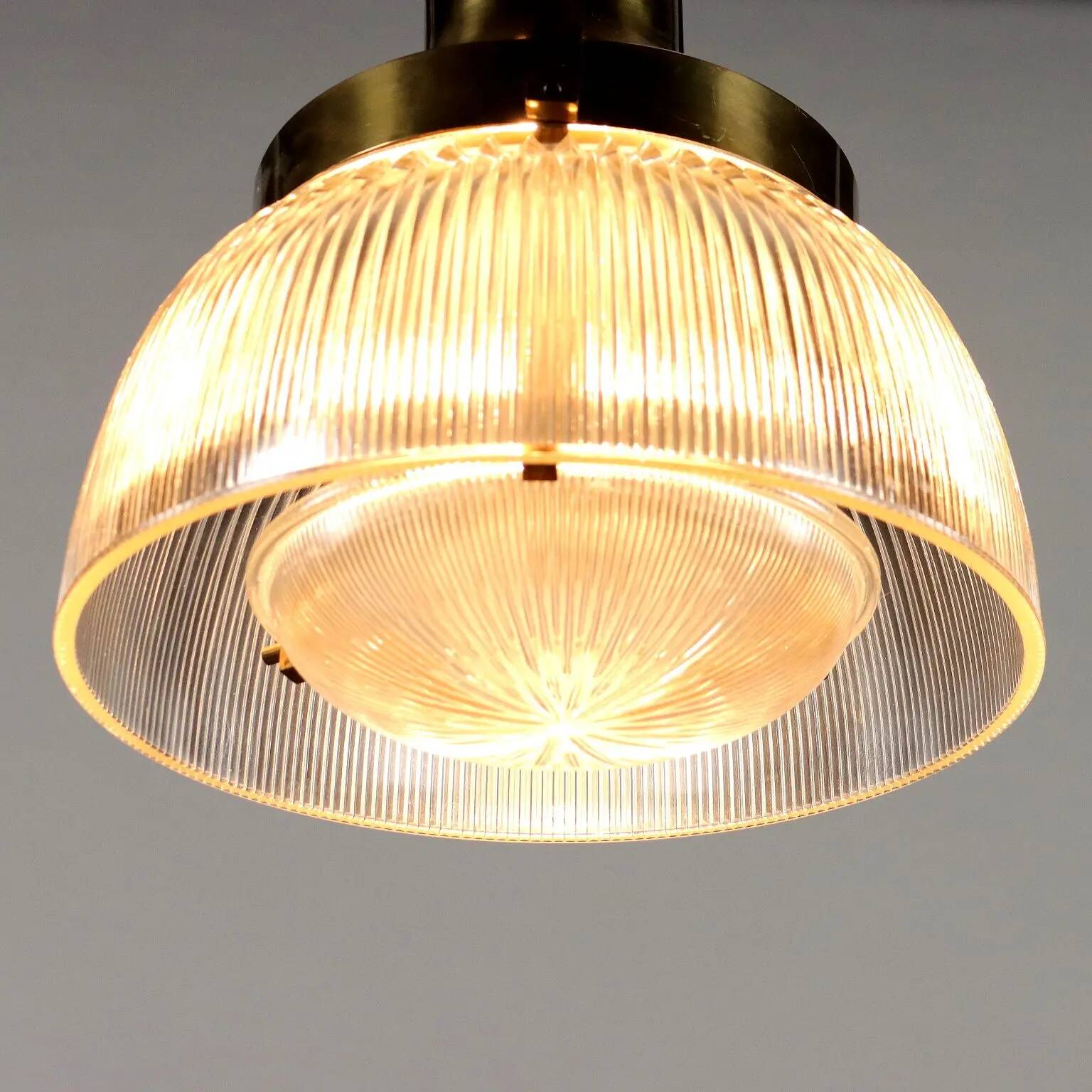 Vintage ceiling light from the 1960s in brass and glass.