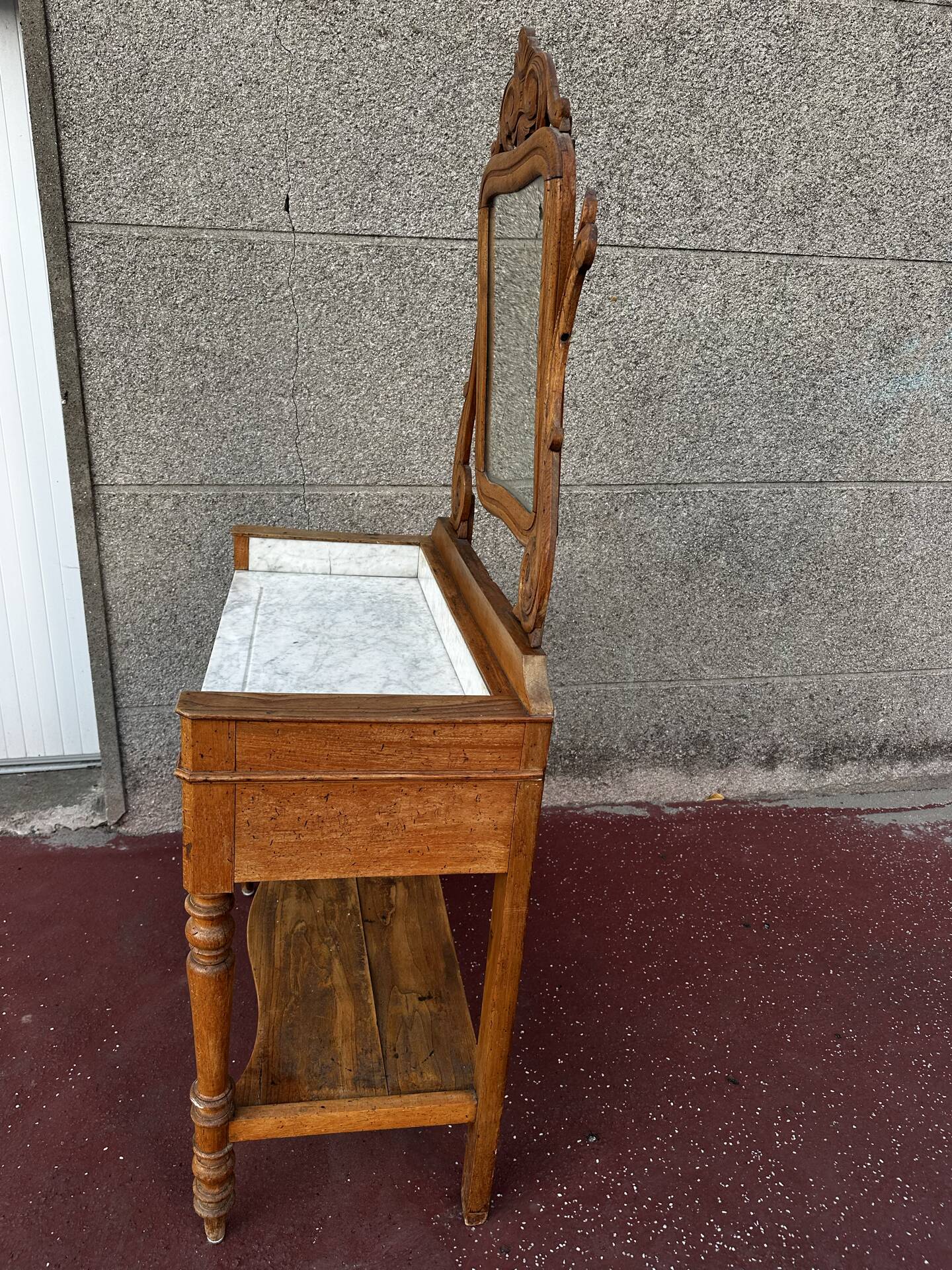 Walnut and marble dressing table, mercury mirror, circa 1850.