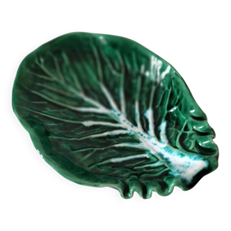 Vintage green slipware bowl in the shape of a cabbage leaf.