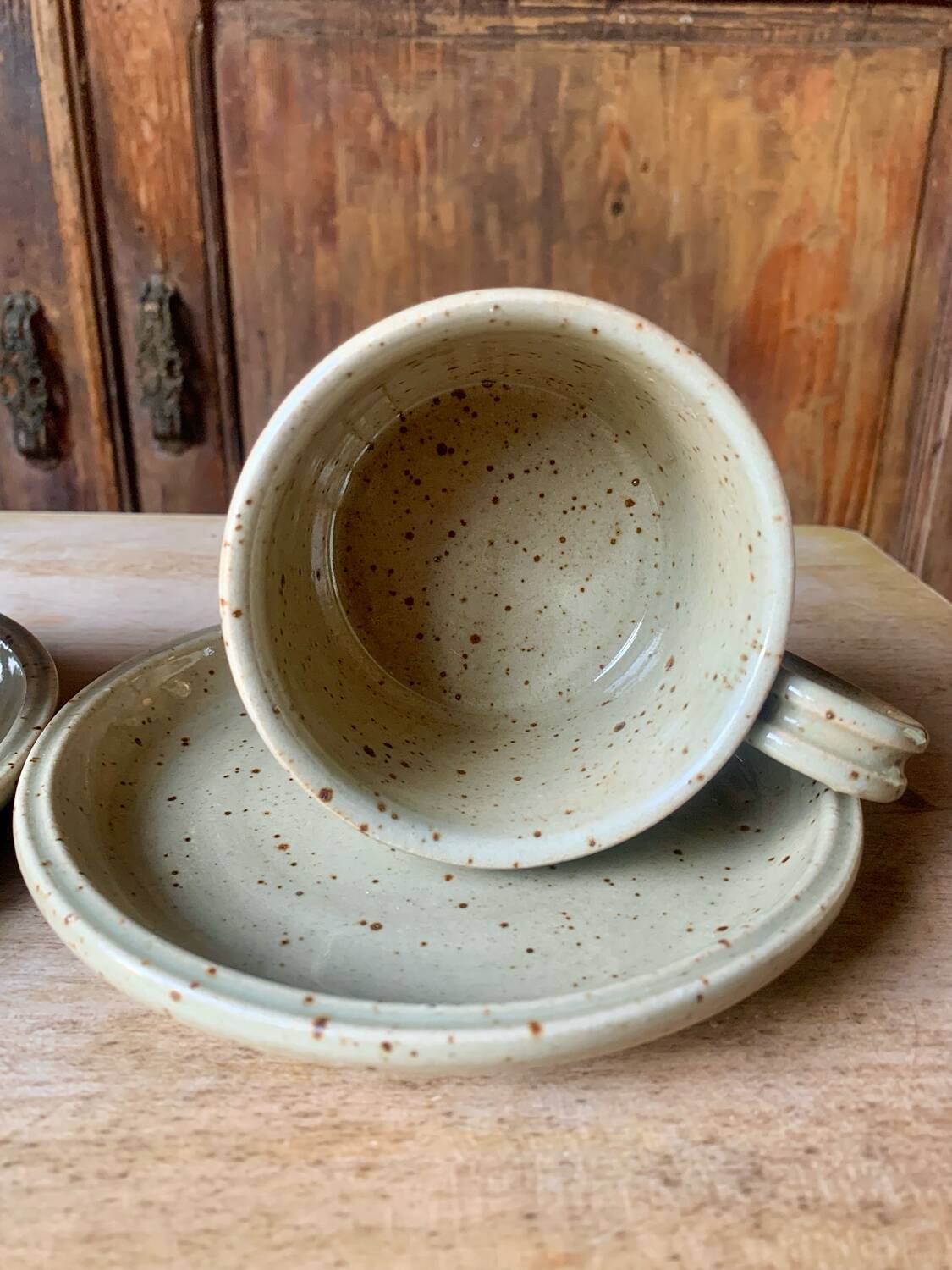 Two large Jean Austruy stoneware cups and saucers