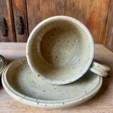 Two large Jean Austruy stoneware cups and saucers