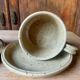 Two large Jean Austruy stoneware cups and saucers