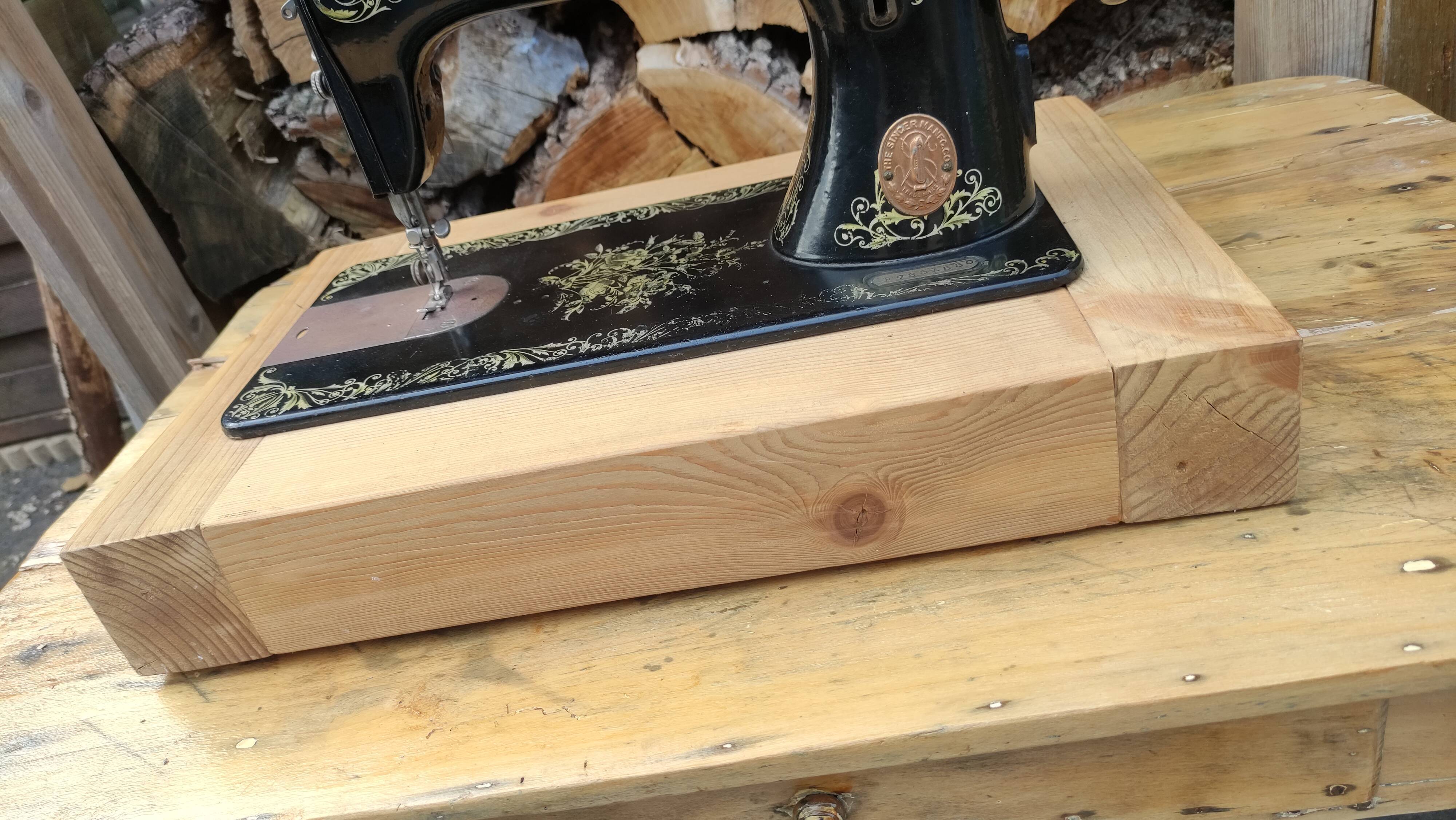 Old Singer sewing machine on pedestal