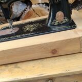 Old Singer sewing machine on pedestal