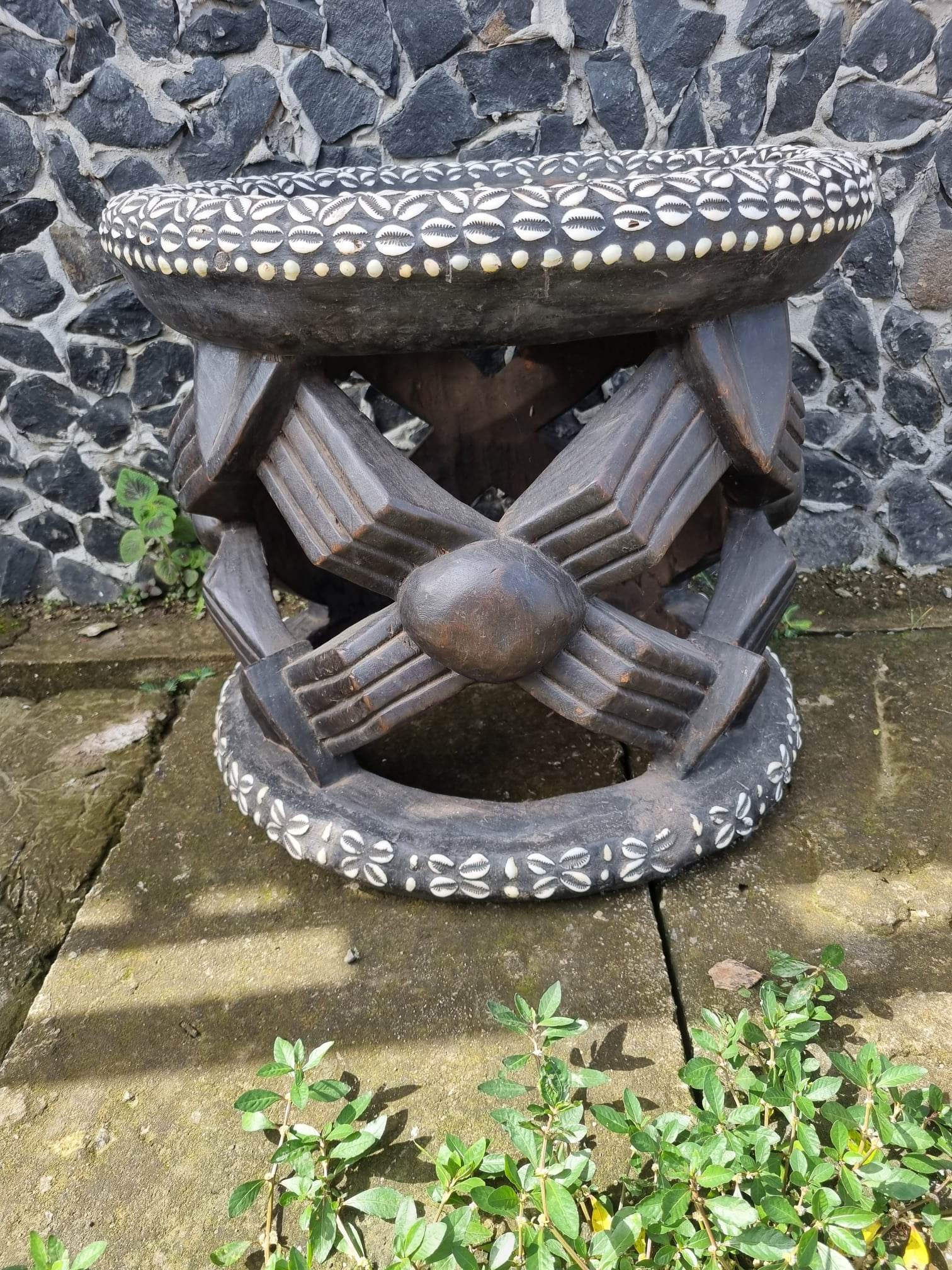 African bamileke coffee table decorated with cowries and coins