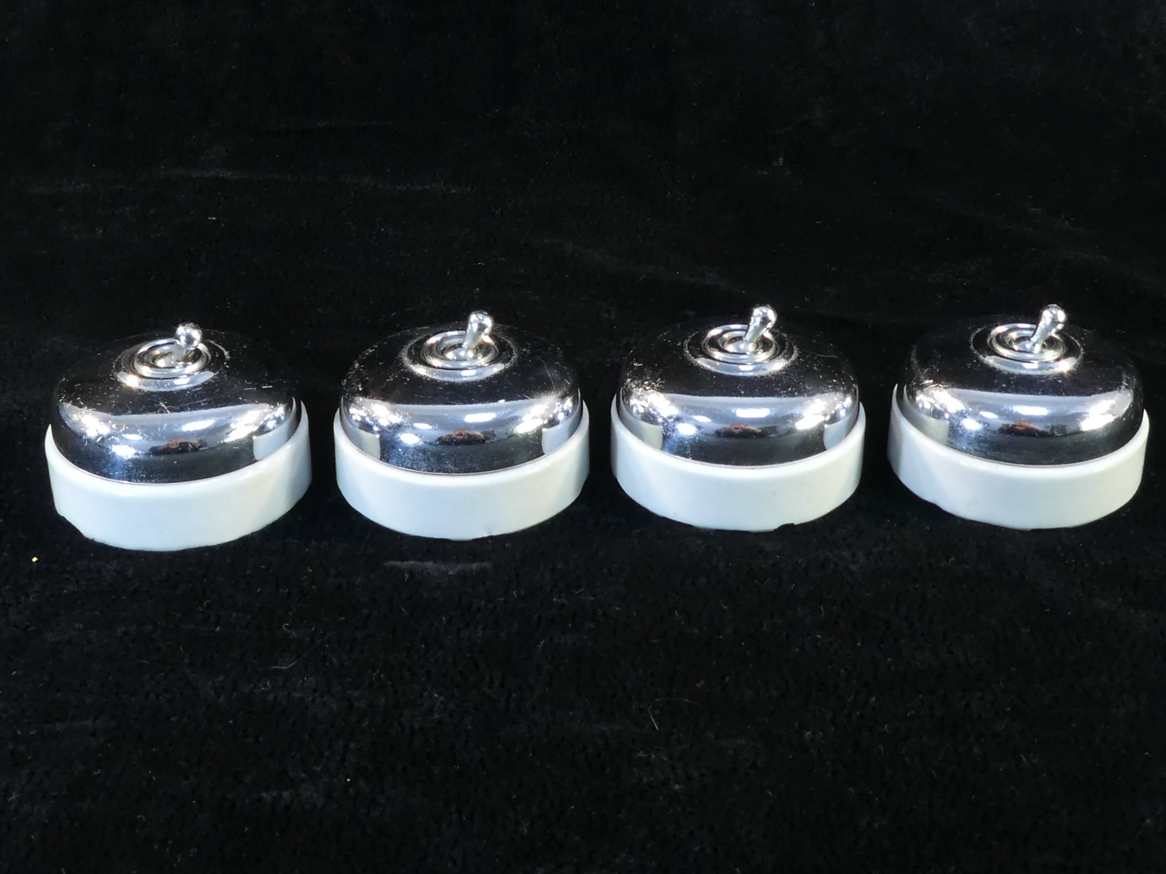 Set of 4 old porcelain and chrome switches