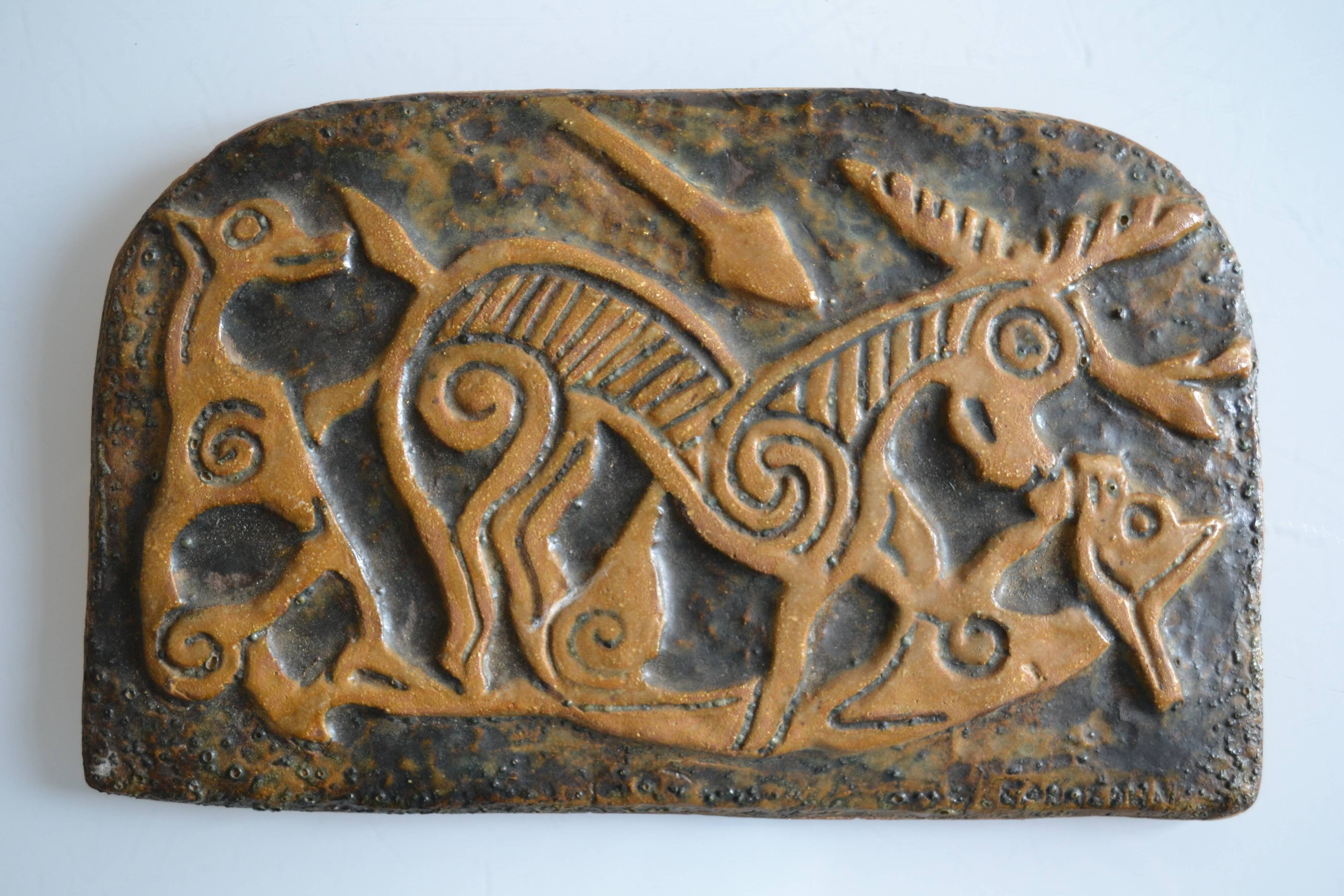 Bas-relief sculpture in terracotta inspired by the Celtic bestiary