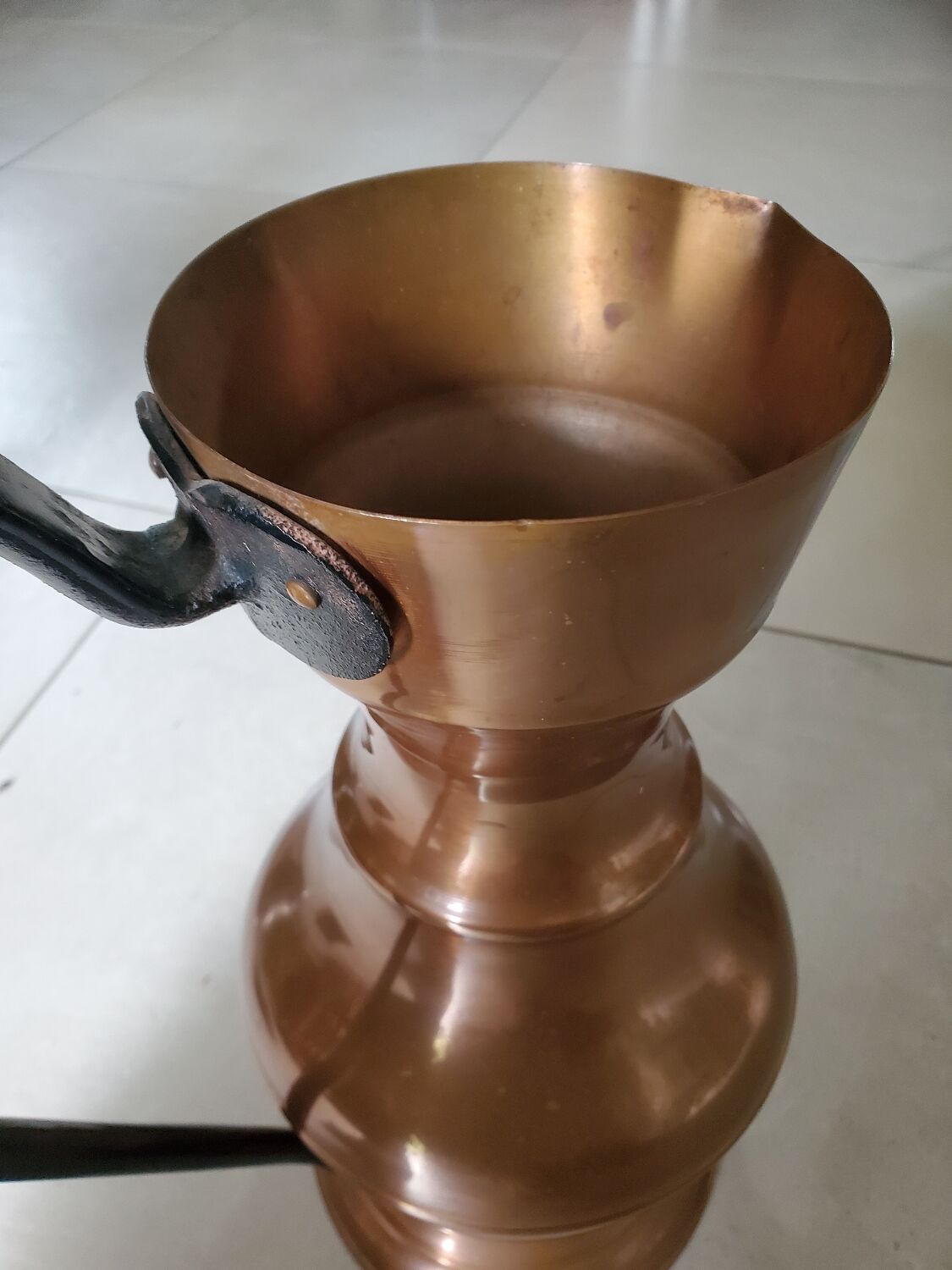 Copper jug with iron handle