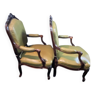 Pair of large 19th-century green leather armchairs in Louis XV style.