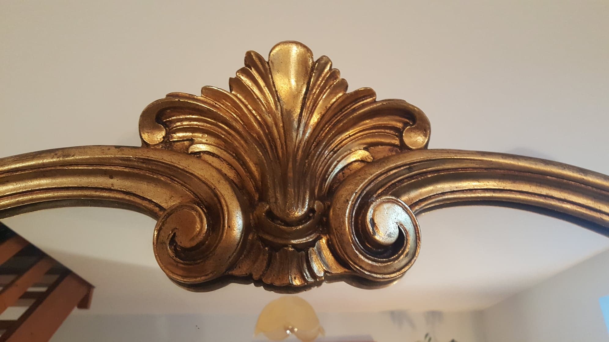 Mirror with golden mouldings