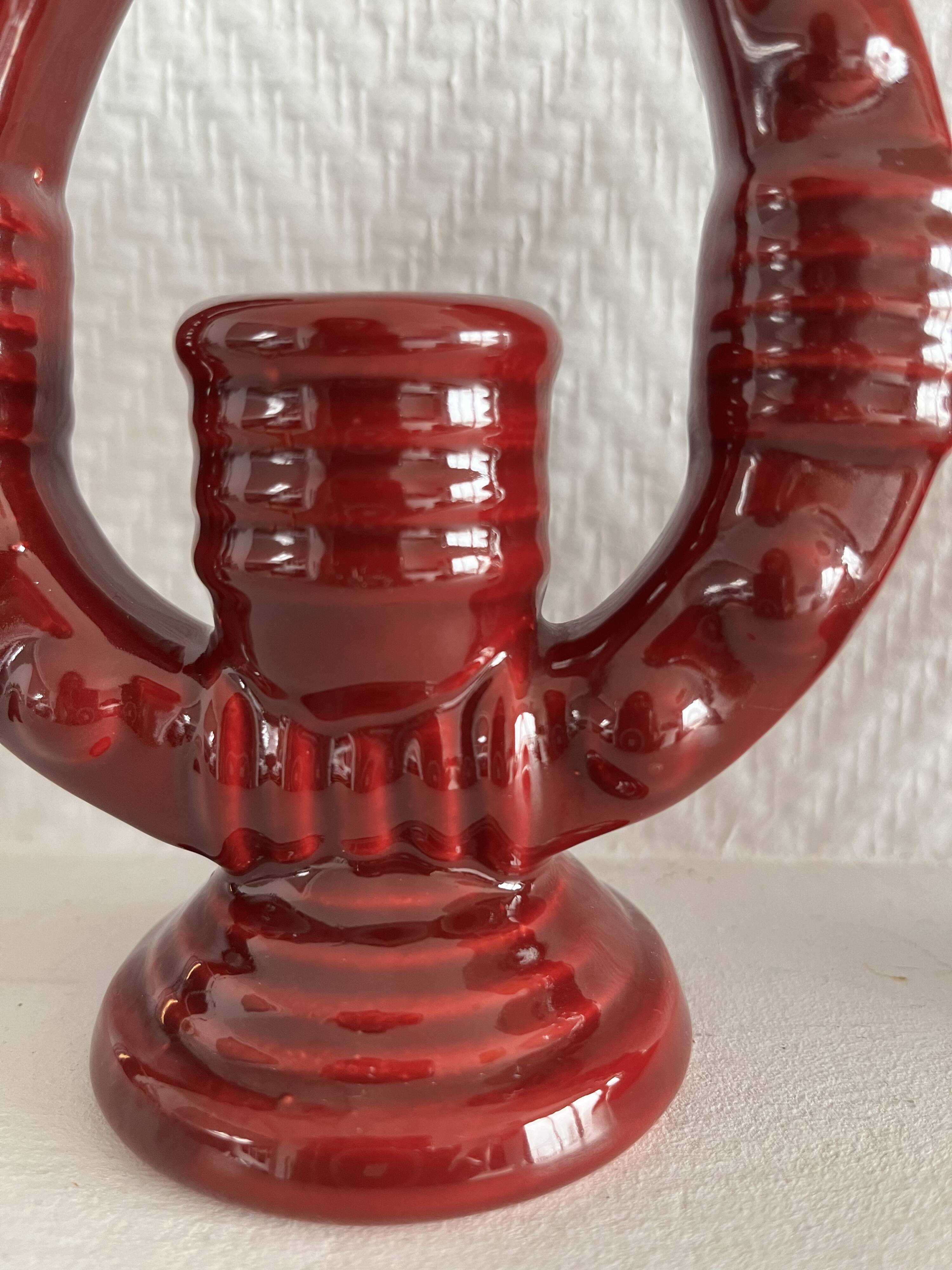 2 fifties red ceramic candle holders, horseshoe pattern