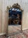 Miroir Napoléon III en bois et stuc doré
