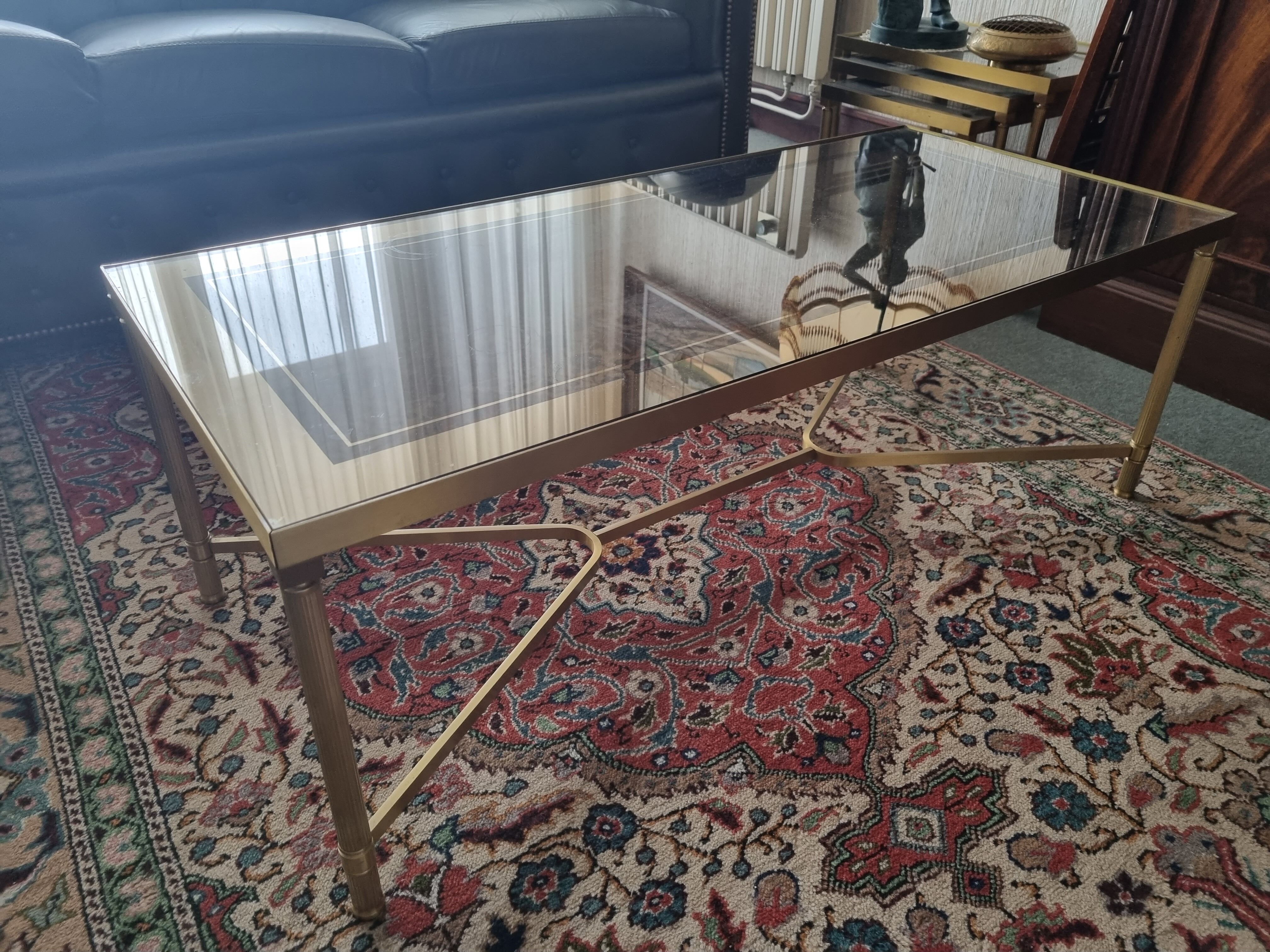 Coffee table in gilded brass and glass top