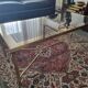 Coffee table in gilded brass and glass top