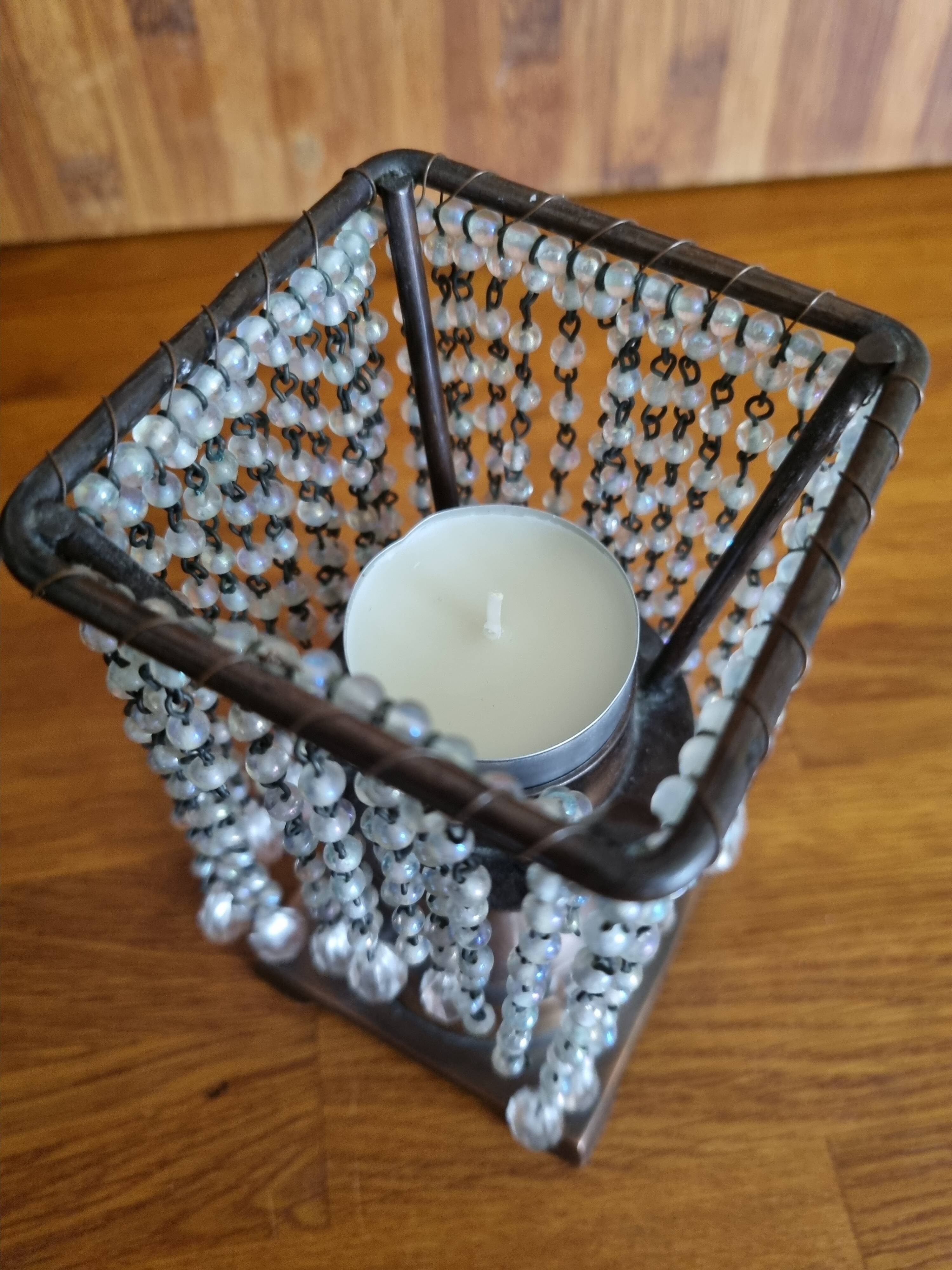 Metal candle holder with white glass tassels