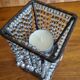 Metal candle holder with white glass tassels
