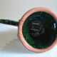 Green ceramic sun candlestick from Tamegroute, Morocco.
