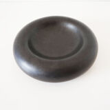 Empty round pocket in black ceramic