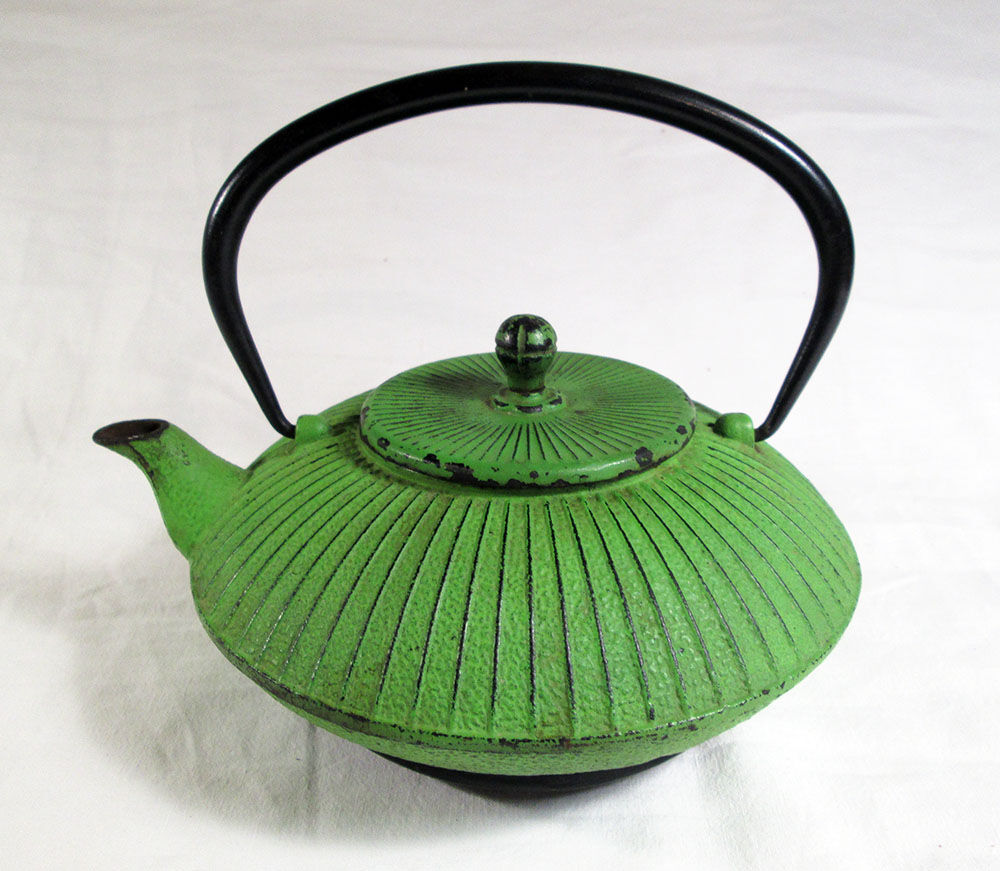 Flat cast iron teapot