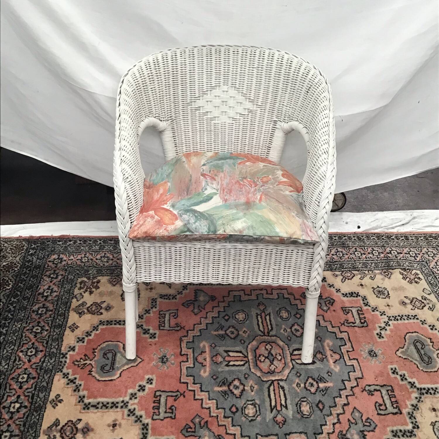 White rattan armchair with pretty vintage