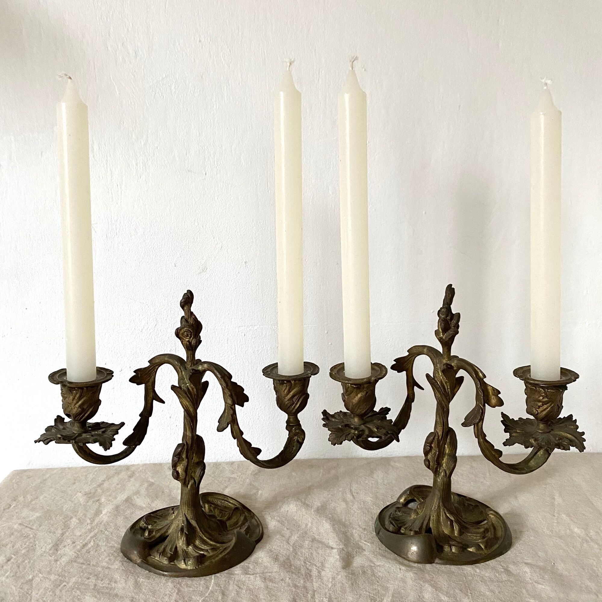 Pair of antique bronze candlesticks at the end of the table XIXth