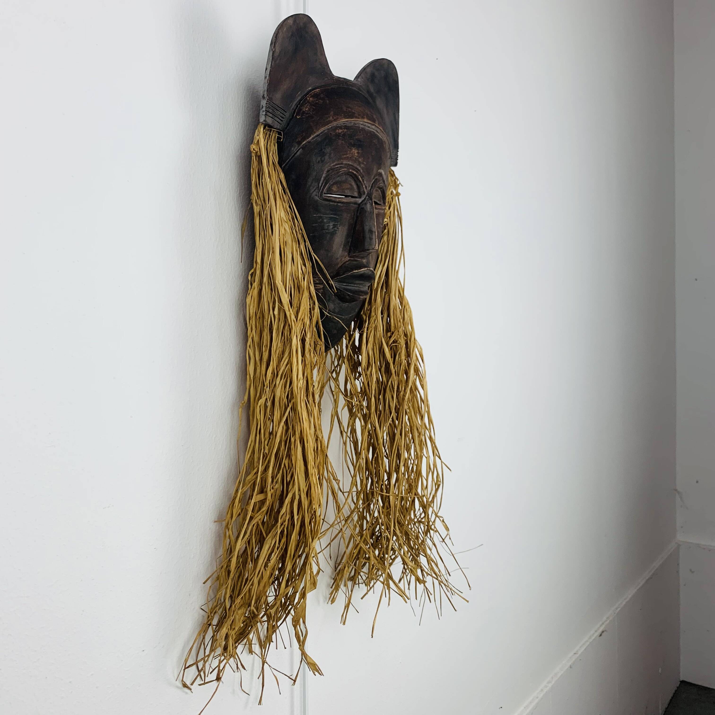 African ceramic and raffia mask signed BJ