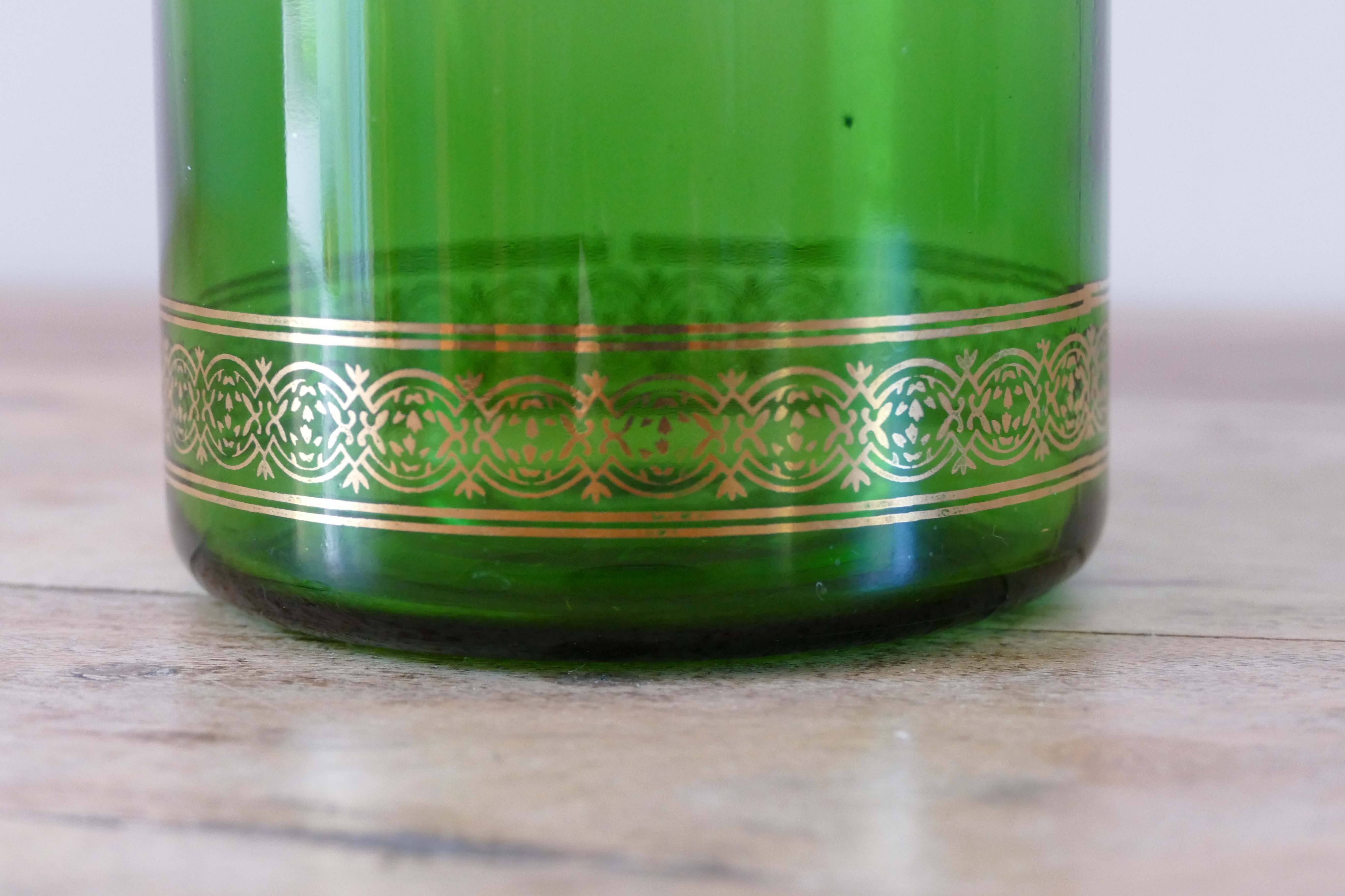 Green vintage apothecary pot and golden ledé