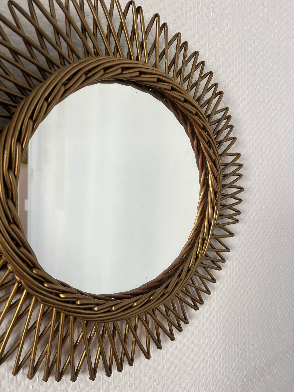 Vintage gold rattan sun mirror