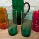 Mismatched colored glass orangeade set with pitcher and 6 glasses