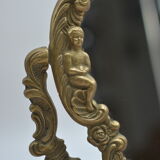 Adjustable psyche mirror of 33 centimeters in gilded bronze with angel ornament