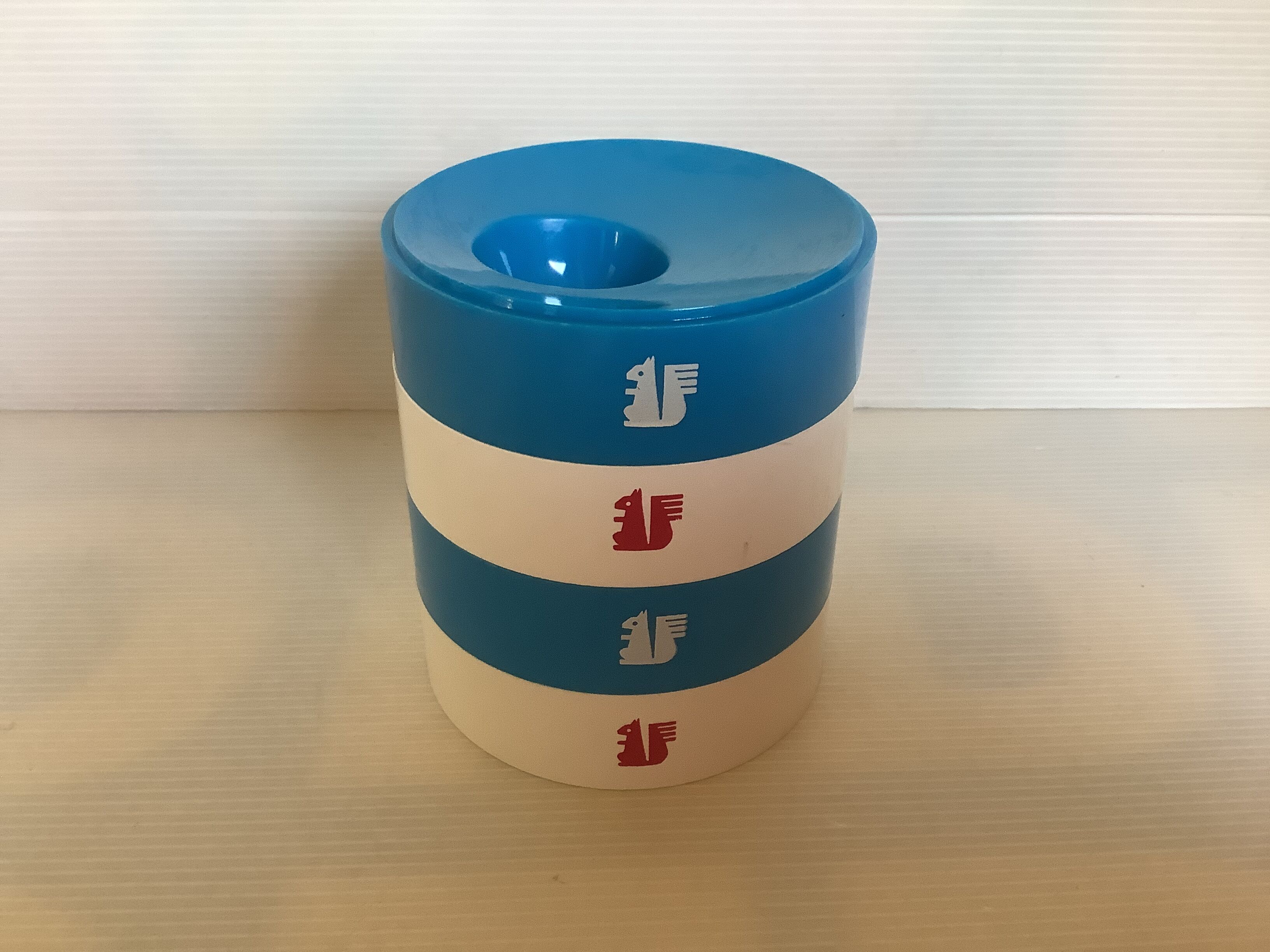 Four round blue and white egg cups from the 1970s.