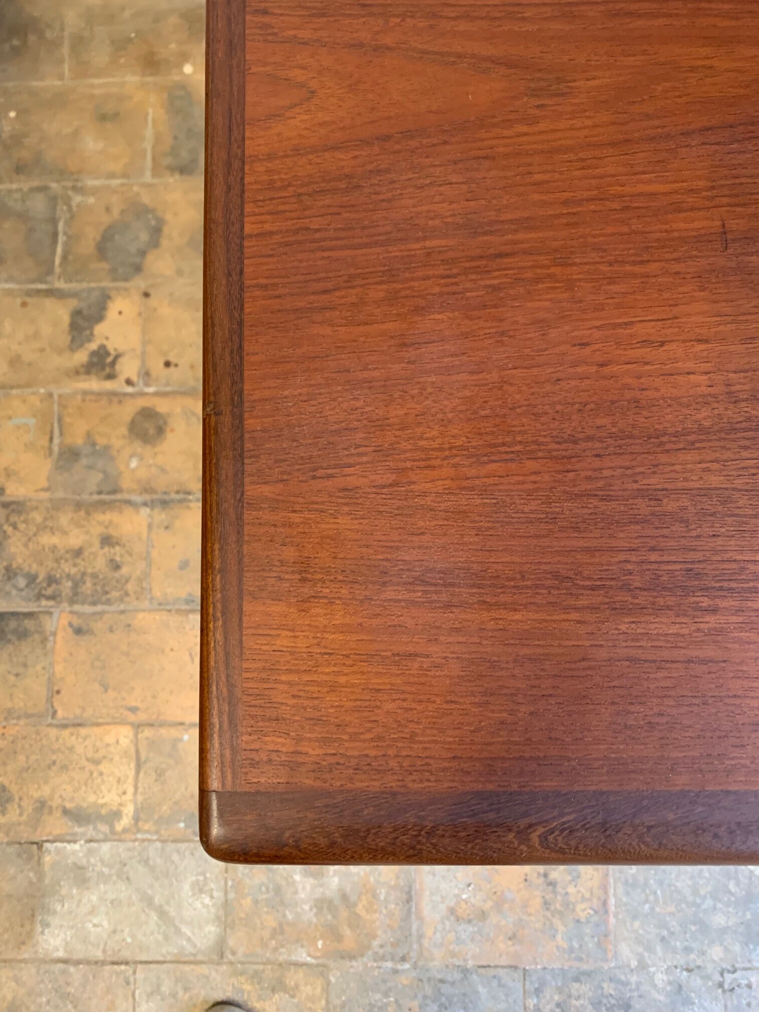 Dark teak dining table by Johannes Andersen for Uldum Møbelfabrik, Denmark