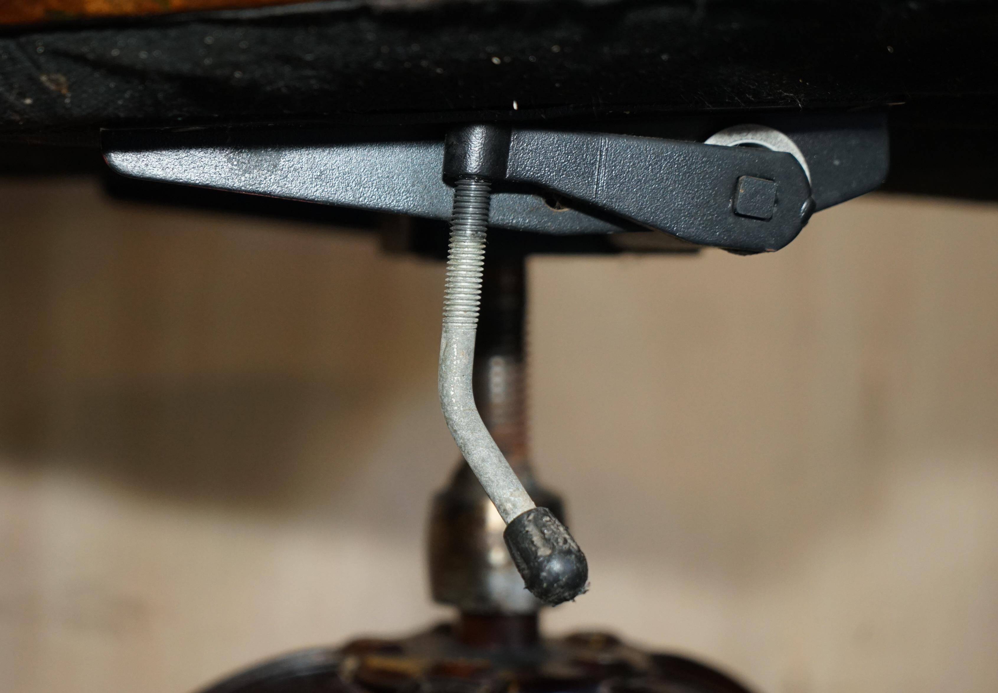 Vintage Chesterfield captain's chair in leather