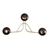 Golden brass coat rack with 3 black vintage hooks from the Mid Century 1950-60.