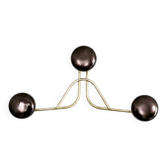 Golden brass coat rack with 3 black vintage hooks from the Mid Century 1950-60.