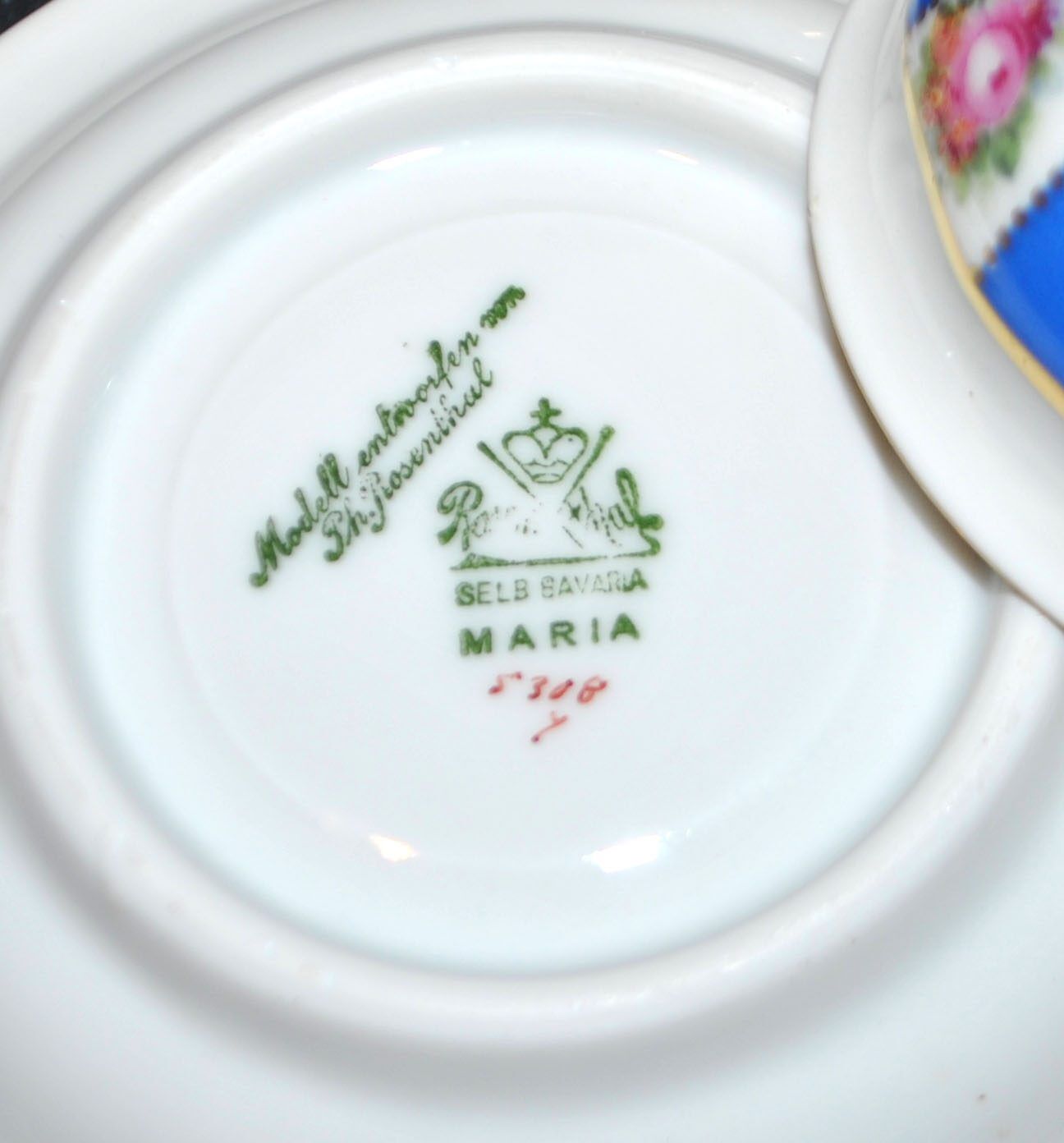 Maria collector's cup in blue and gold German porcelain.