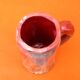 Traditional ceramic mug with a marbled glaze effect.