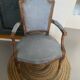 Pair of cabriolet armchairs in light grey and dark grey Louis XV style.