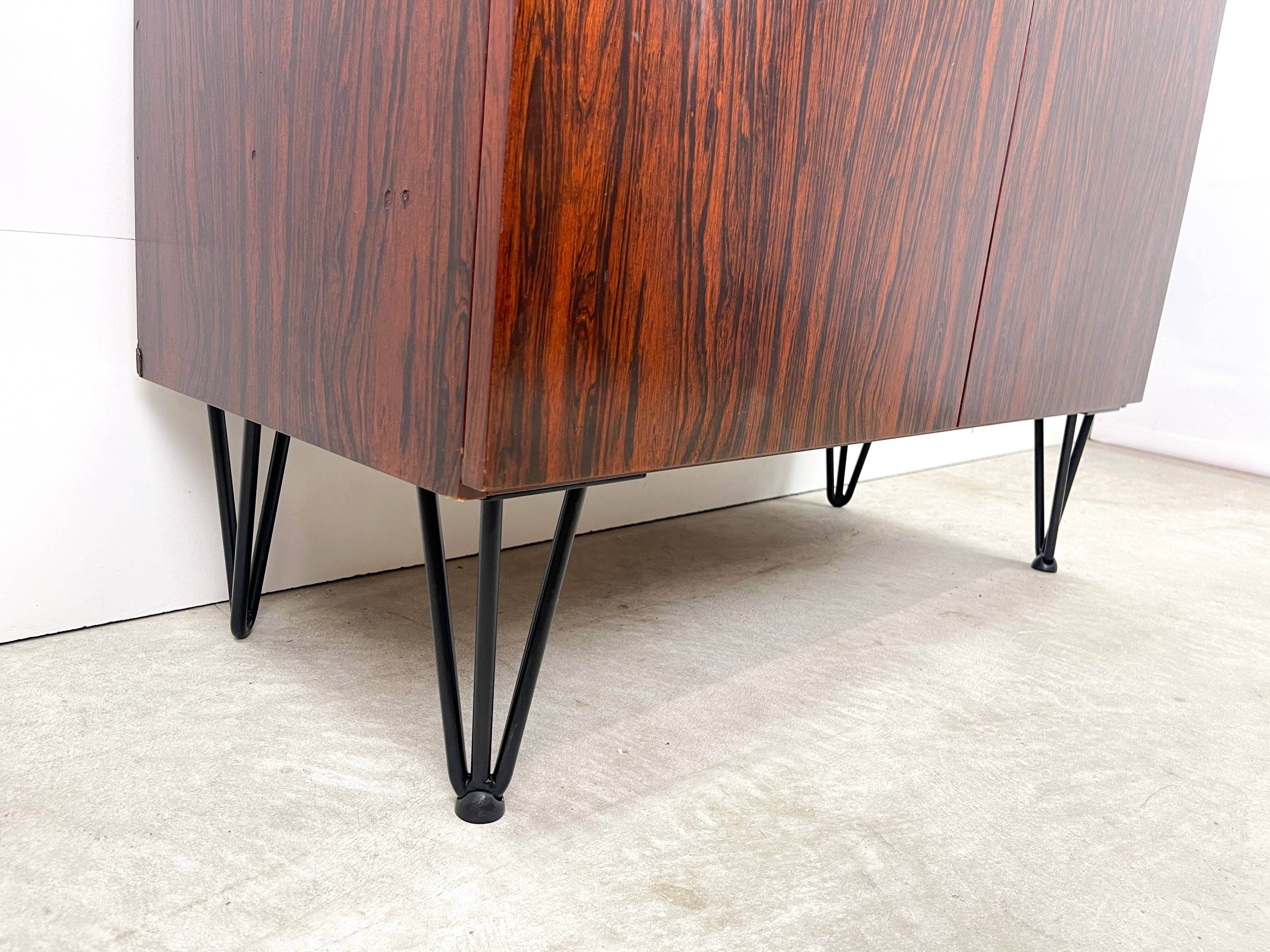 Rosewood cabinet with hairpin legs
