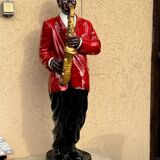 Large black and red jazz figurine in fibreglass, decorative sculpture from the 1960s.