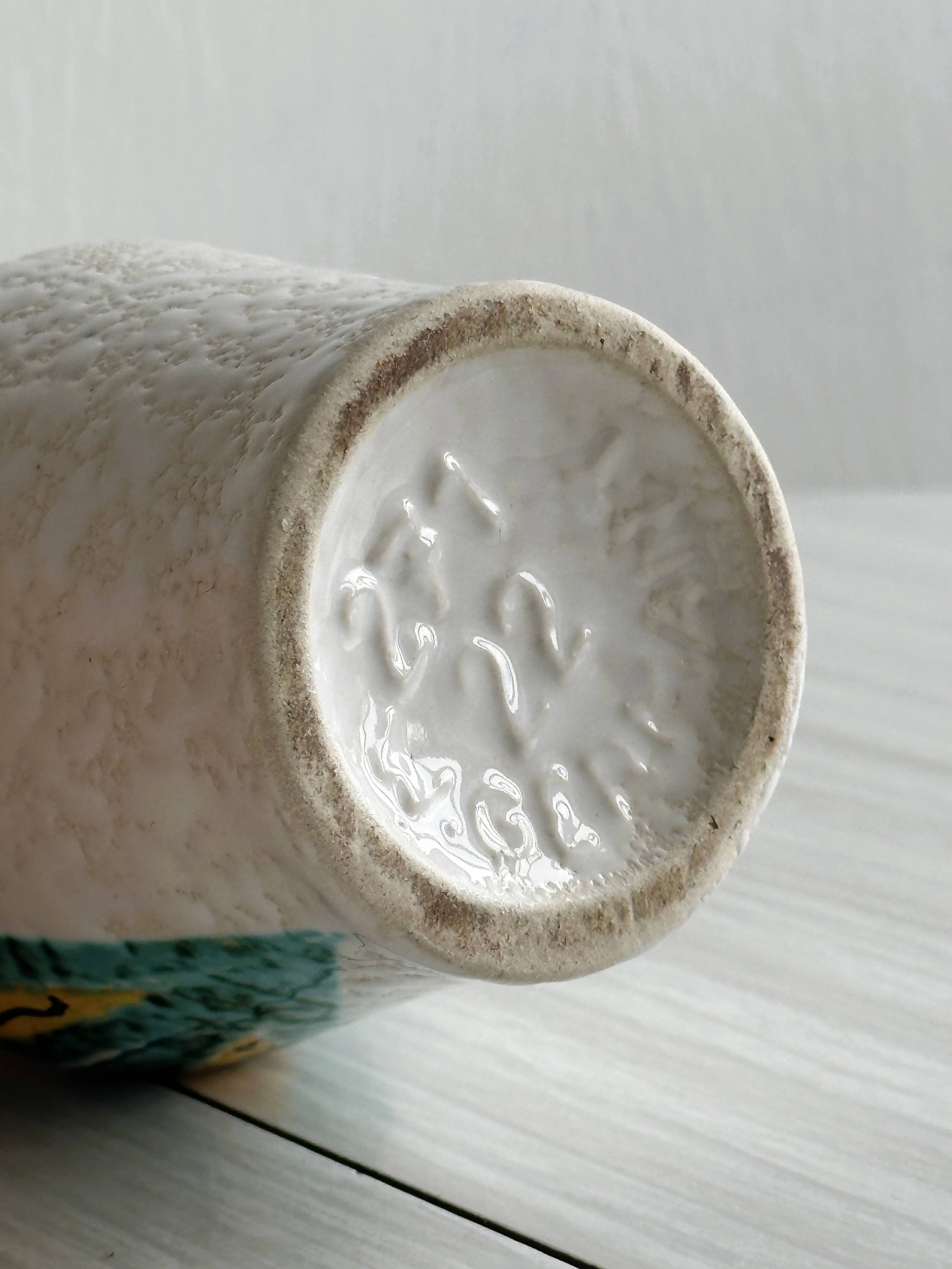 Ceramic flower pitcher.