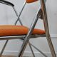 Chaise orange pliable