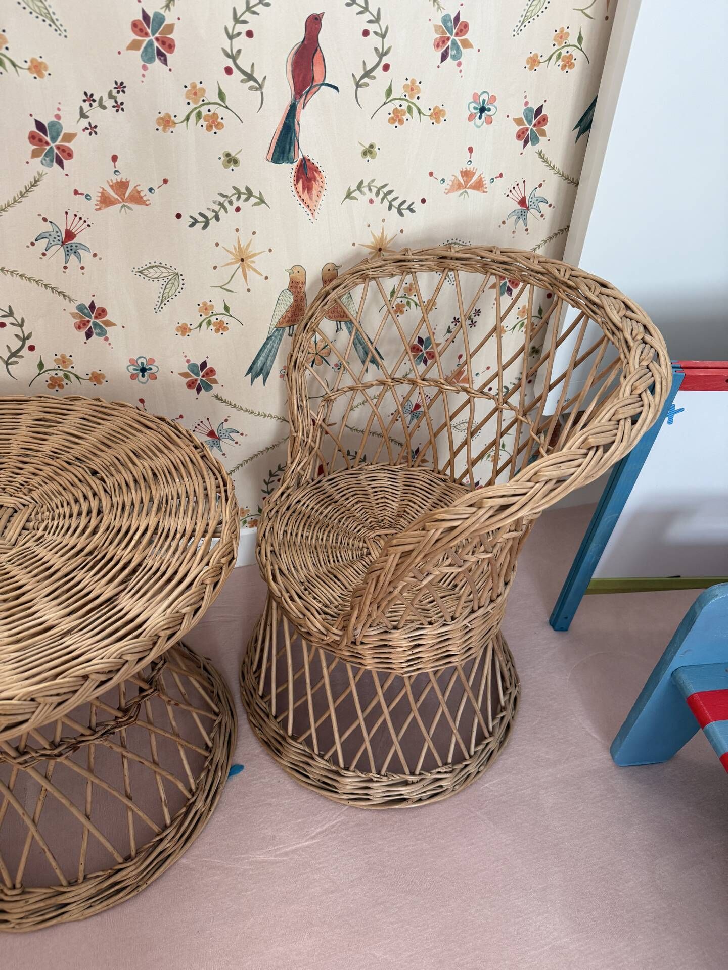 Table and two wicker chairs for children.