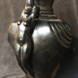 Black ceramic vase caught in naked women's bodies