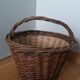 Woven wicker basket with handle
