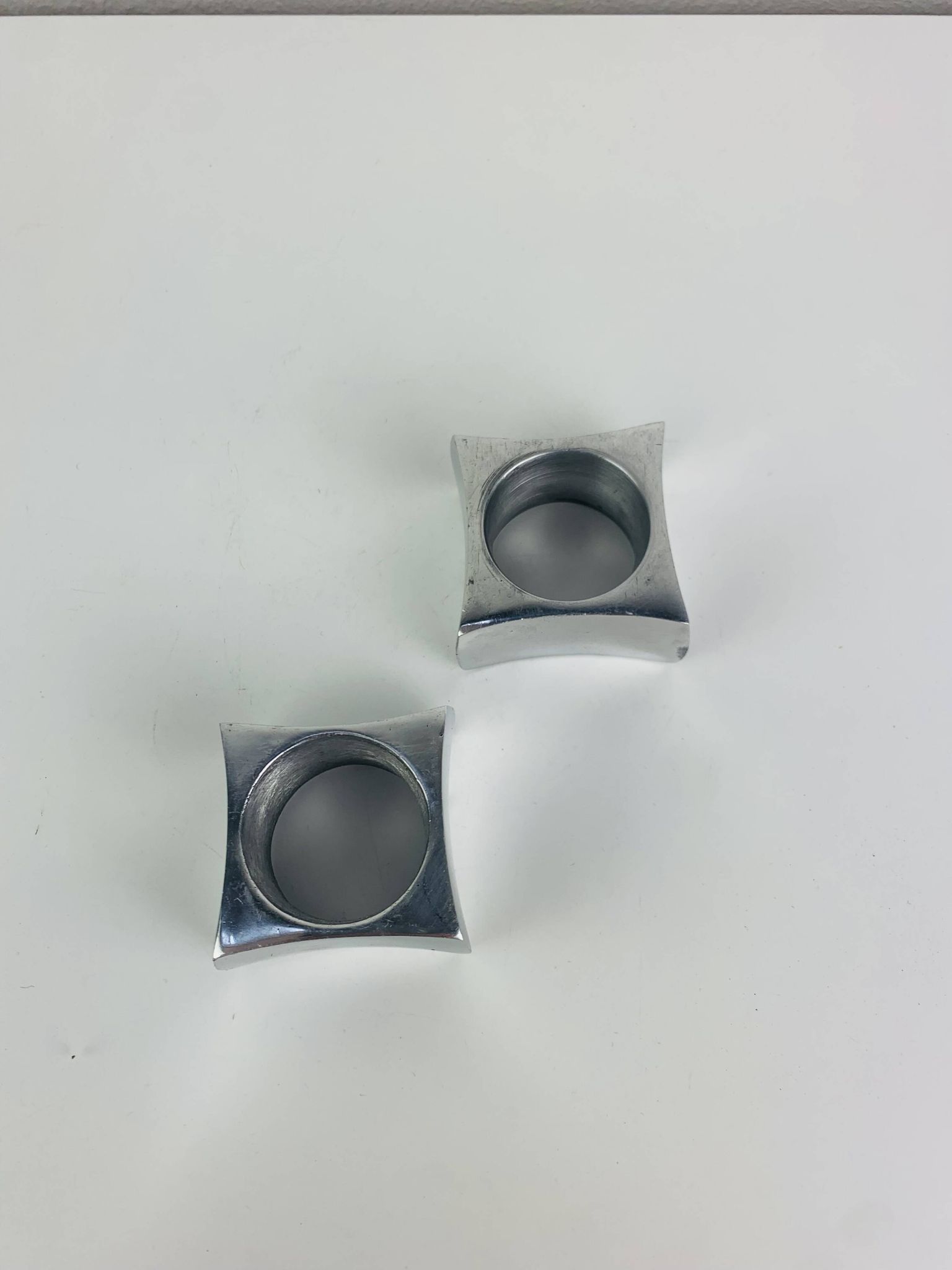 Pair of egg cups or space age napkin rings in aluminium, 1970s.
